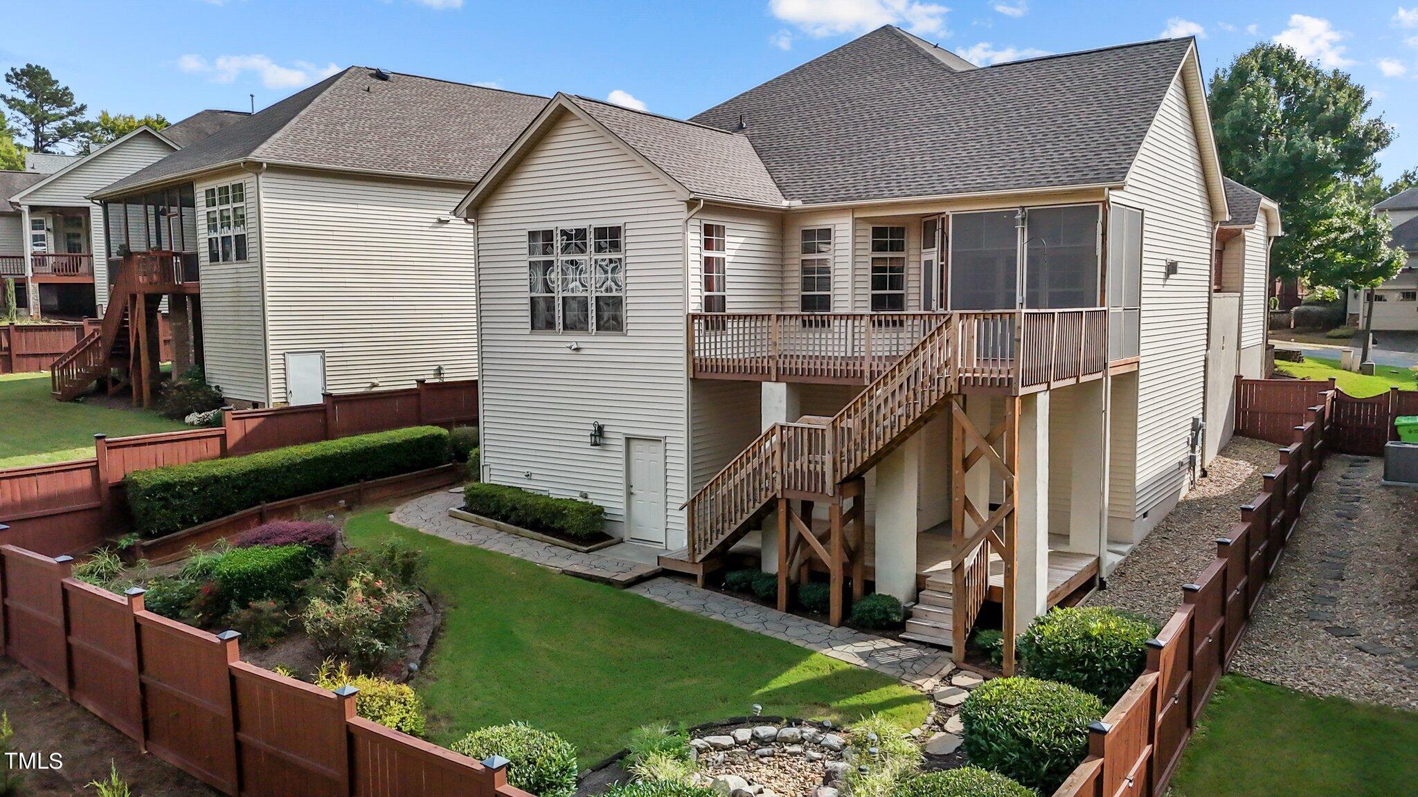 6112 Blakeman Lane Raleigh, NC 27617 - Photo 49 of 56 a view of a house with a yard and potted plants