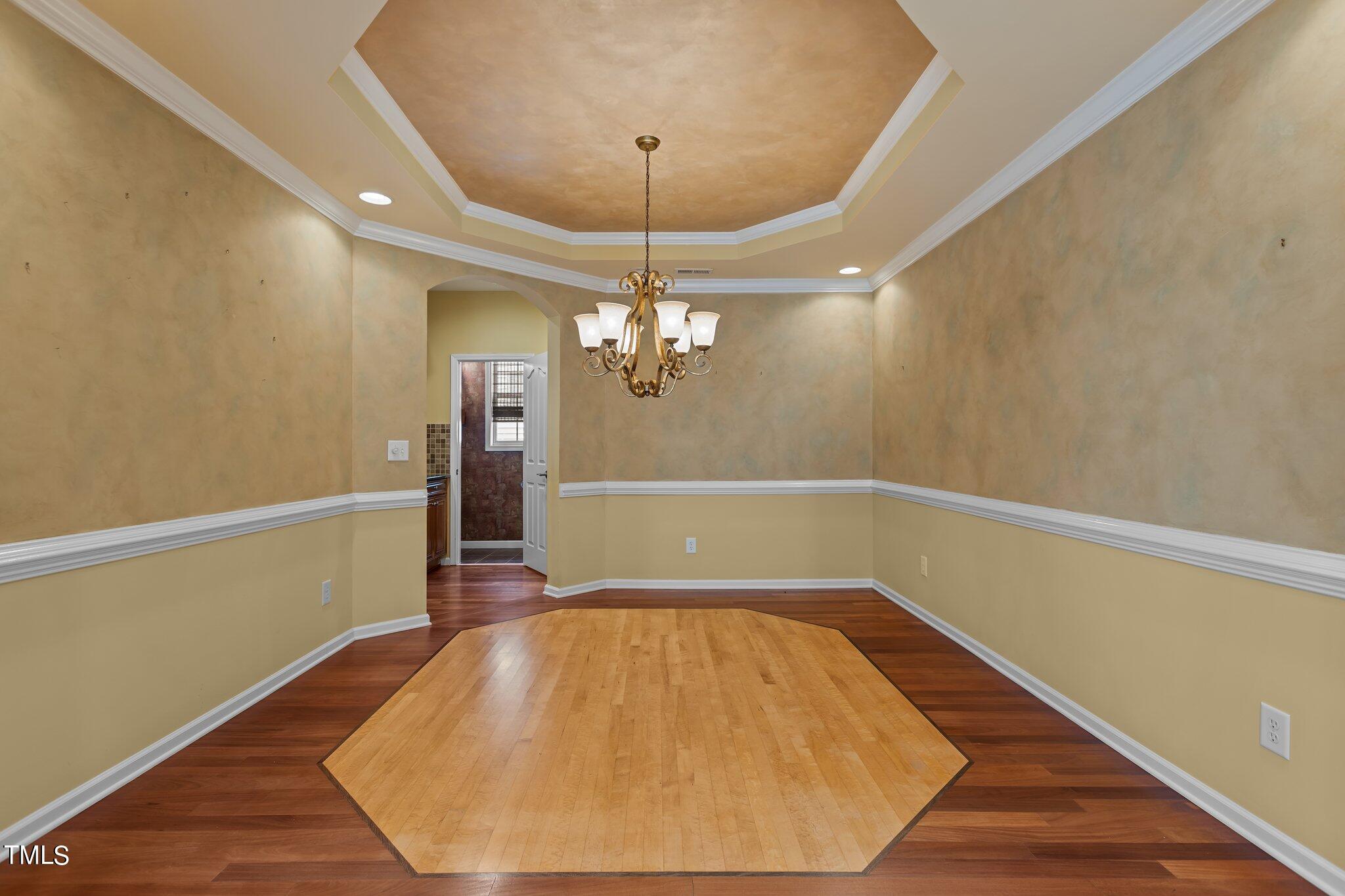 6112 Blakeman Lane Raleigh, NC 27617 - Photo 10 of 56 a view of a room with wooden floor and staircase