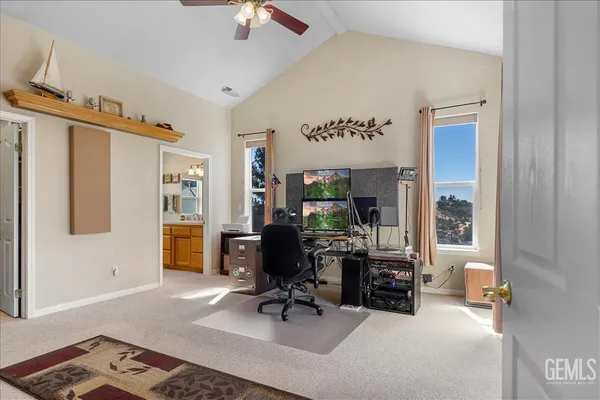 a bedroom with furniture and a window