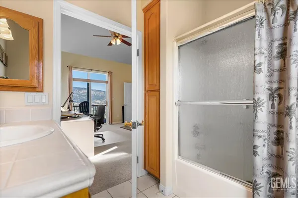a bathroom with a sink double vanity and a mirror