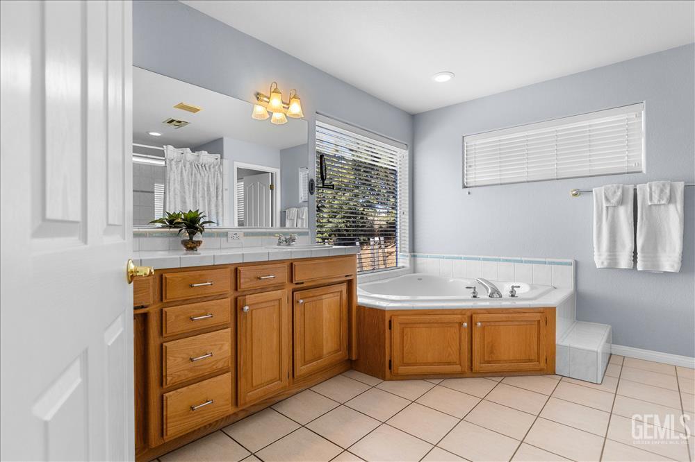 Undisclosed Address Tehachapi, CA 93561 - Photo 36 of 62 a bathroom with a sink double vanity and a mirror