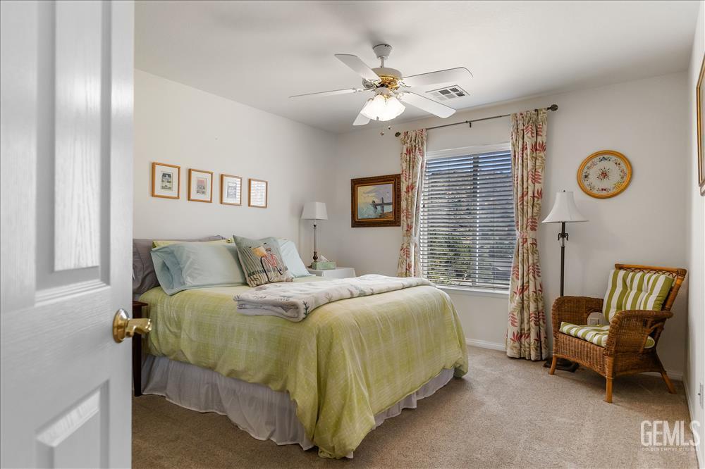 Undisclosed Address Tehachapi, CA 93561 - Photo 41 of 62 a bedroom with a bed and a chandelier