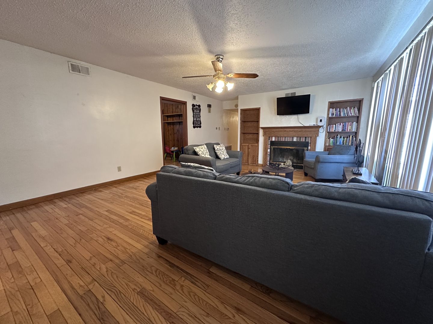 1107 Locust Street Sterling, IL 61081 - Photo 2 of 16 a living room with furniture and a fireplace