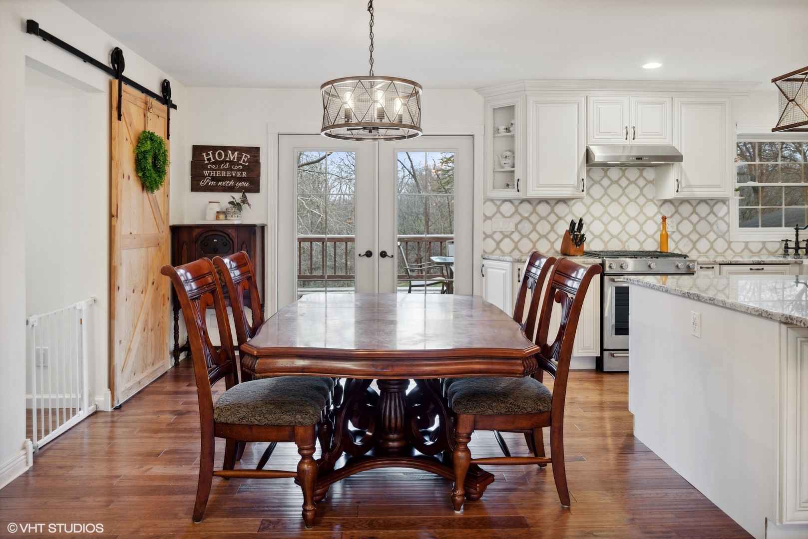 607 Pine Street Batavia, IL 60510 - Photo 6 of 39 a view of a dining room with furniture wooden floor and chandelier