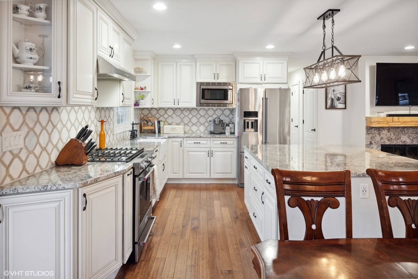 607 Pine Street Batavia, IL 60510 - Photo 7 of 39 a kitchen with stainless steel appliances granite countertop a stove top oven a sink a counter space and cabinets