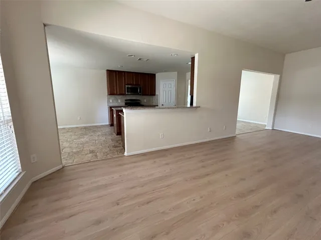 a view of a kitchen from the hallway