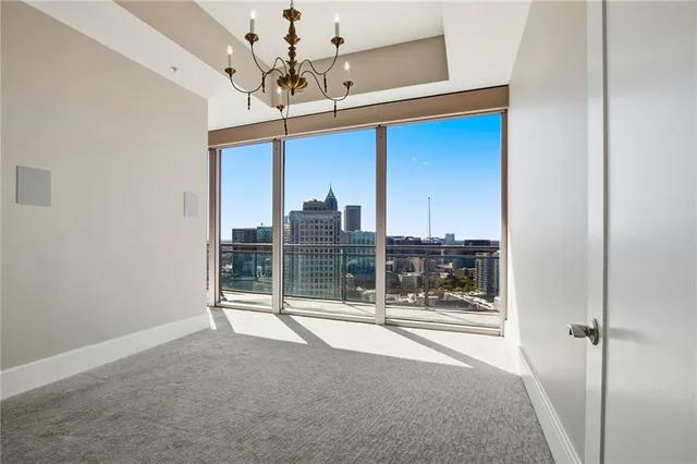 a view of an empty room with a flat screen tv
