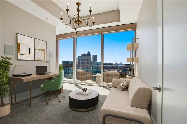 a bedroom with a large bed and a flat screen tv