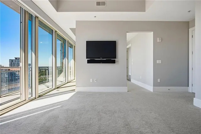 a view of a room with a large window