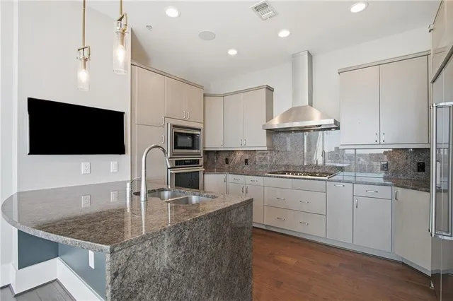 a kitchen with a sink and large window