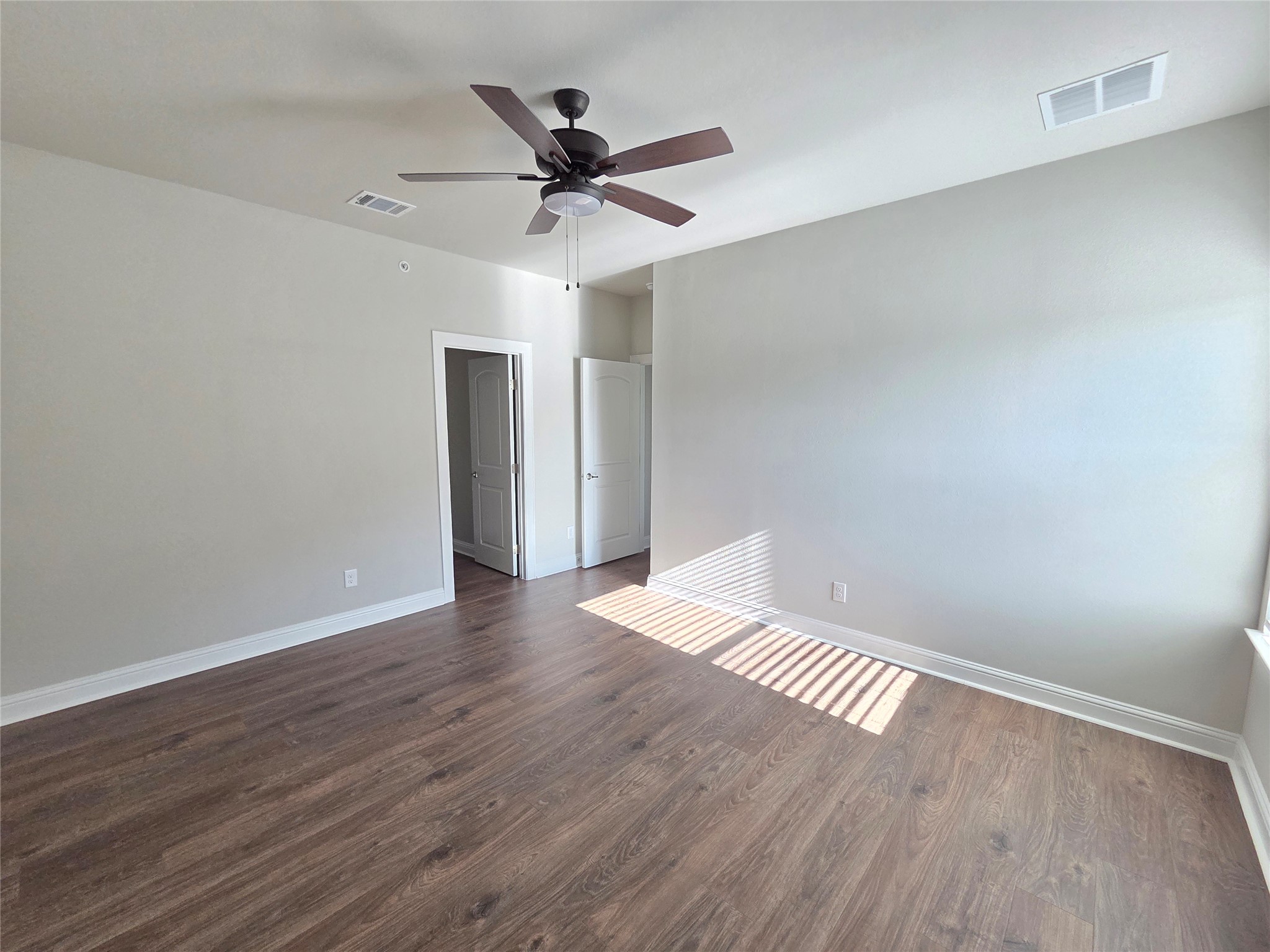 600 C-Bar Ranch Trail, Unit 121 Cedar Park, TX 78613 - Photo 29 of 32 Ample space for rest and relaxation awaits in this comfortably appointed bedroom with rich flooring.