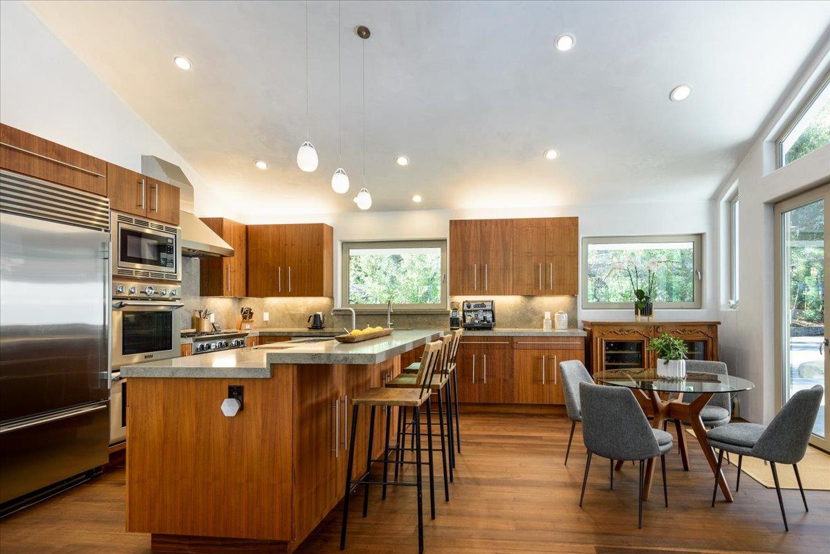 16345 Sanborn Road Saratoga, CA 95070 - Photo 12 of 31 a view of a dining room with furniture window and wooden floor