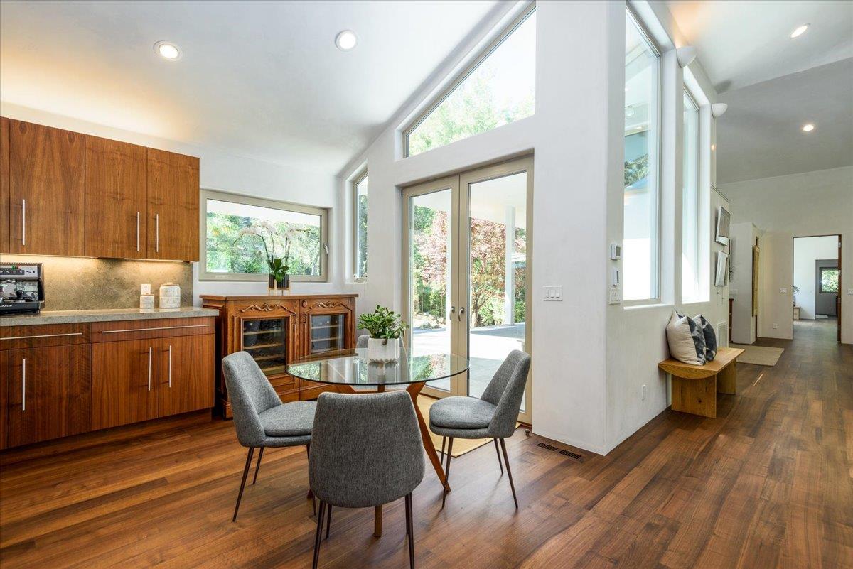 16345 Sanborn Road Saratoga, CA 95070 - Photo 13 of 31 a kitchen with a table chairs and wooden floor