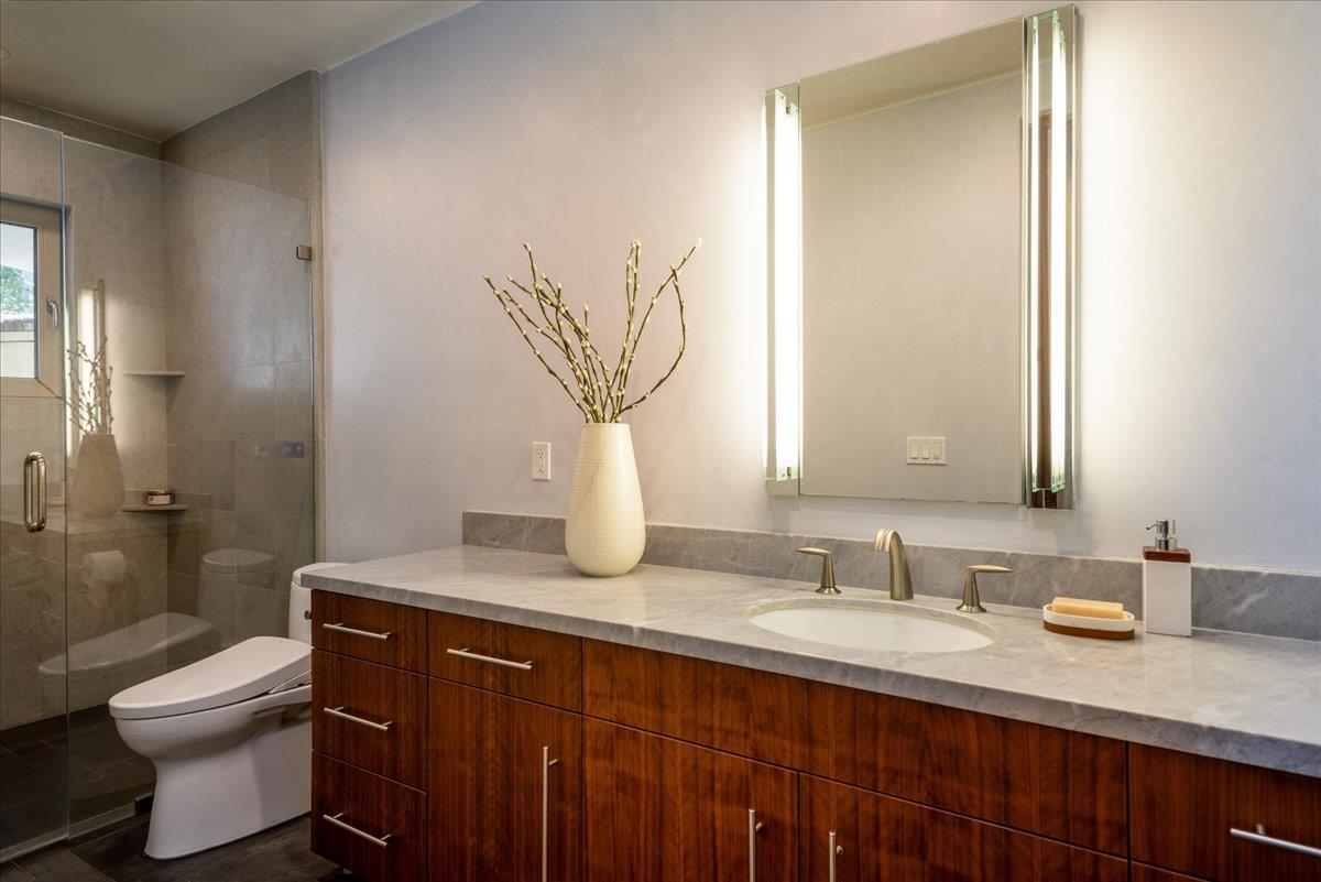16345 Sanborn Road Saratoga, CA 95070 - Photo 18 of 31 a bathroom with a sink a toilet and shower