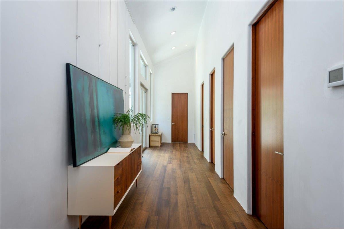 16345 Sanborn Road Saratoga, CA 95070 - Photo 20 of 31 a view of a hallway with wooden floor and staircase