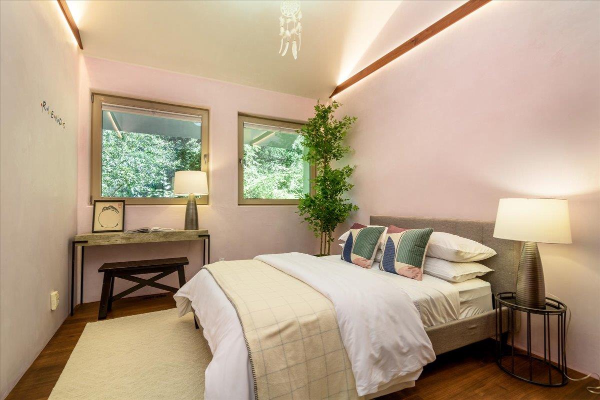 16345 Sanborn Road Saratoga, CA 95070 - Photo 22 of 31 a bedroom with a bed and a table