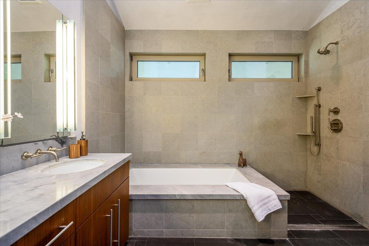 16345 Sanborn Road Saratoga, CA 95070 - Photo 24 of 31 a bathroom with a tub sink and mirror