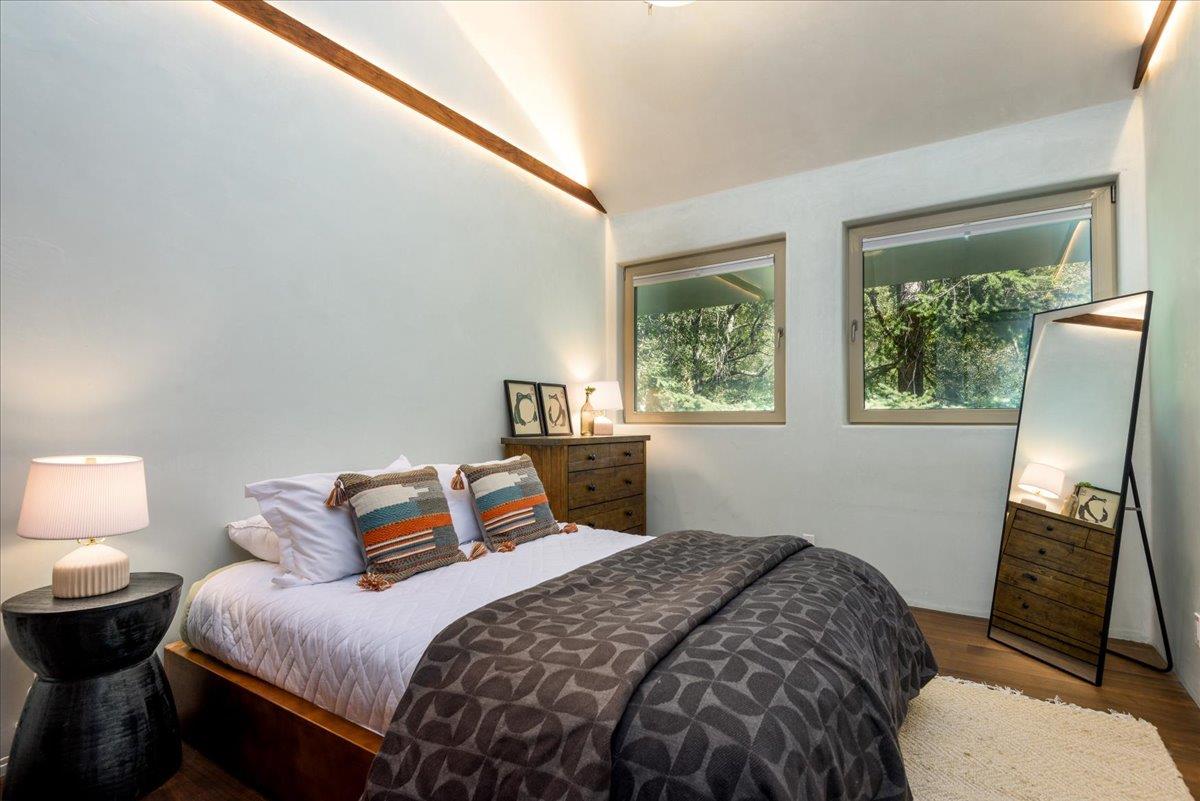 16345 Sanborn Road Saratoga, CA 95070 - Photo 26 of 31 a bedroom with a bed and wooden floor