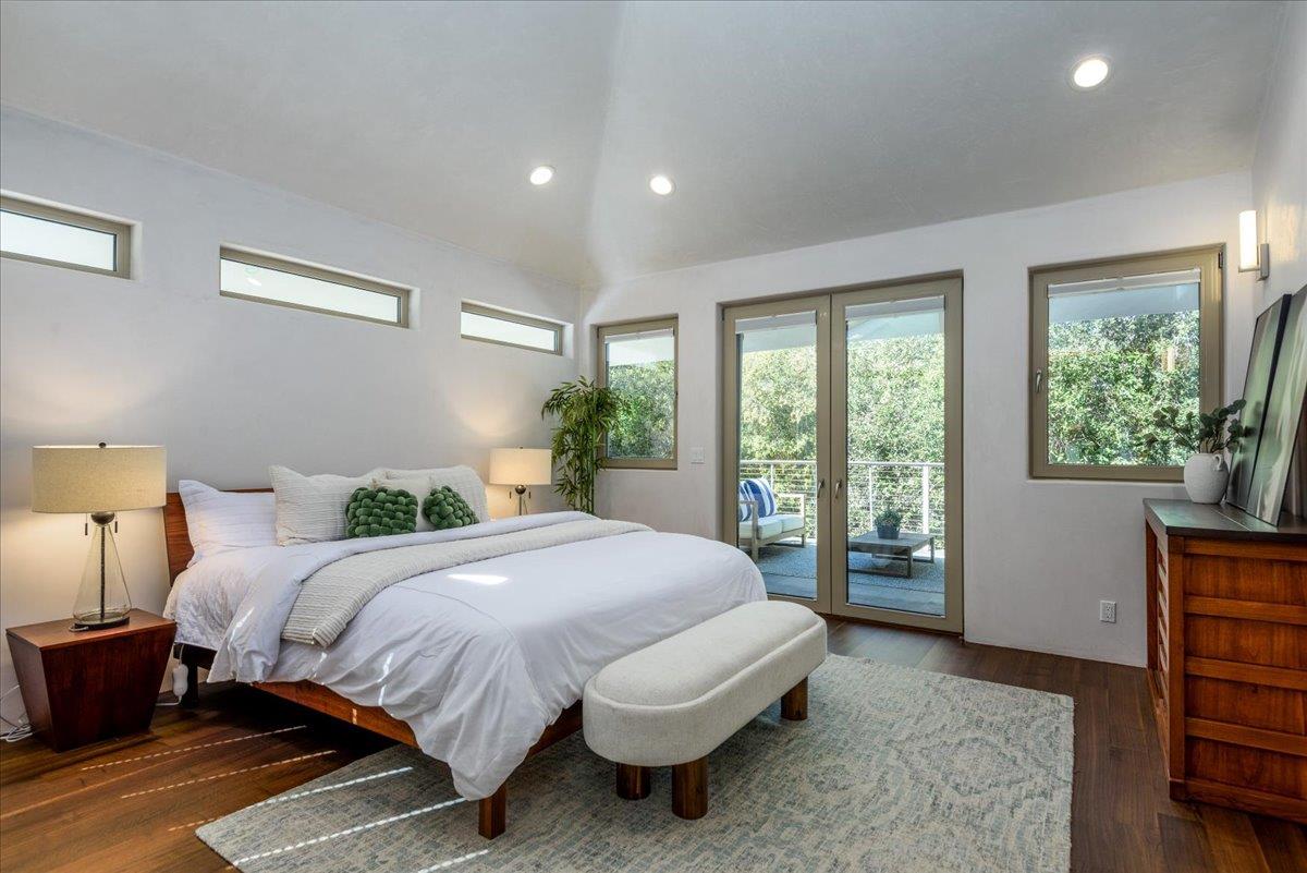 16345 Sanborn Road Saratoga, CA 95070 - Photo 27 of 31 a bedroom with a bed and wooden floor