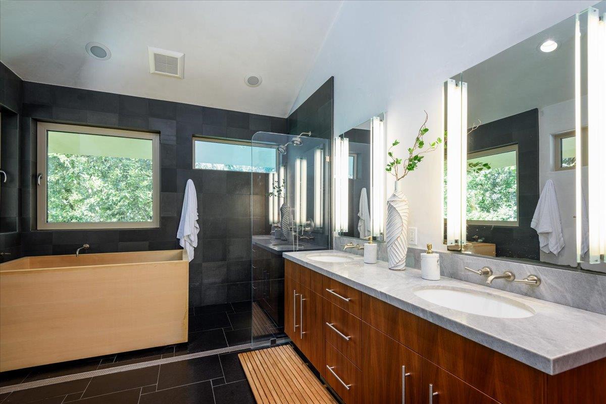 16345 Sanborn Road Saratoga, CA 95070 - Photo 28 of 31 a bathroom with double vanity and a bathtub