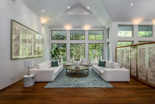 a living room with furniture and a large window