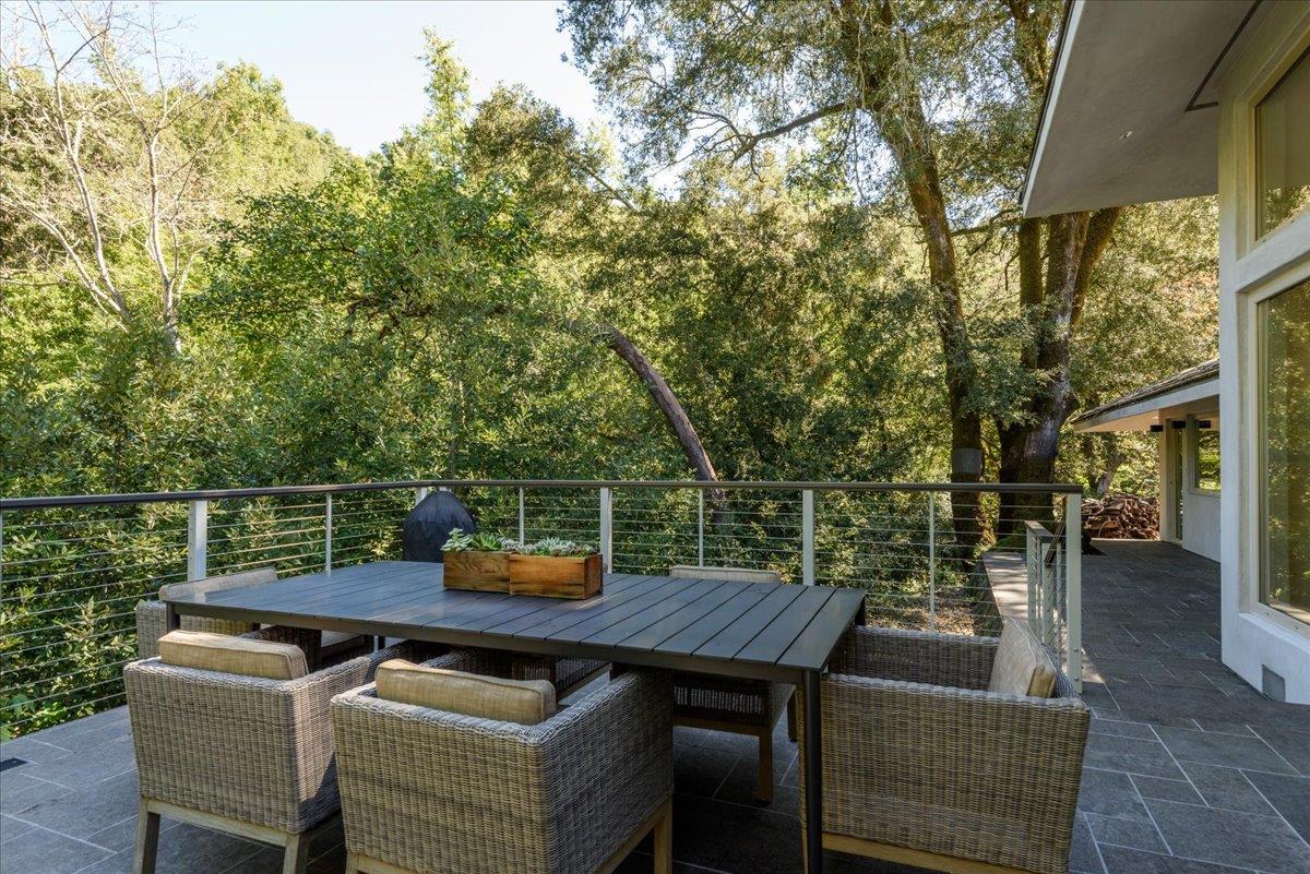 16345 Sanborn Road Saratoga, CA 95070 - Photo 9 of 31 a terrace with outdoor seating and trees