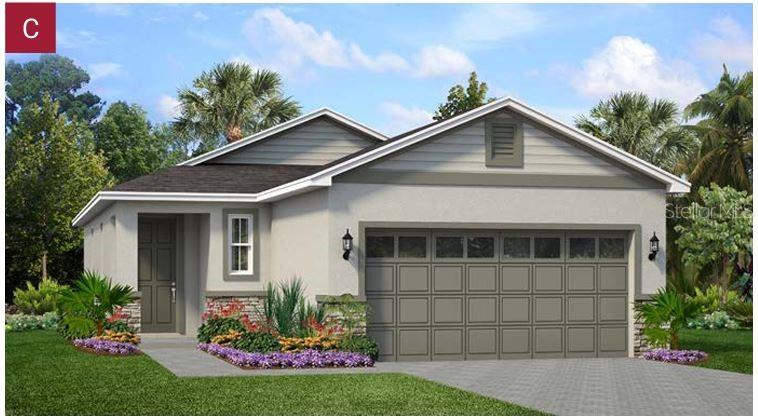 1229 Atlantic Avenue Fruitland Park, FL 34731 - Photo 1 of 4 a front view of a house with a garden
