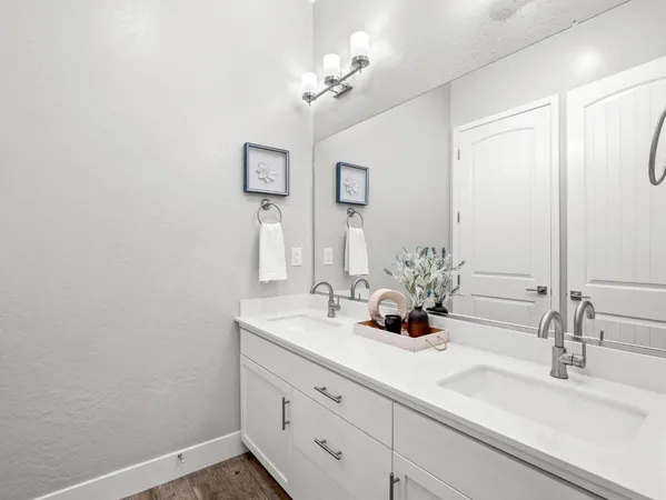a bathroom with a shower a sink and a toilet