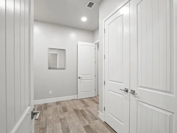 a view of a dining room with furniture wooden floor and chandelier