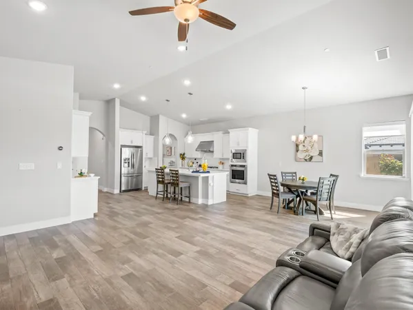 a kitchen with white cabinets and a stove
