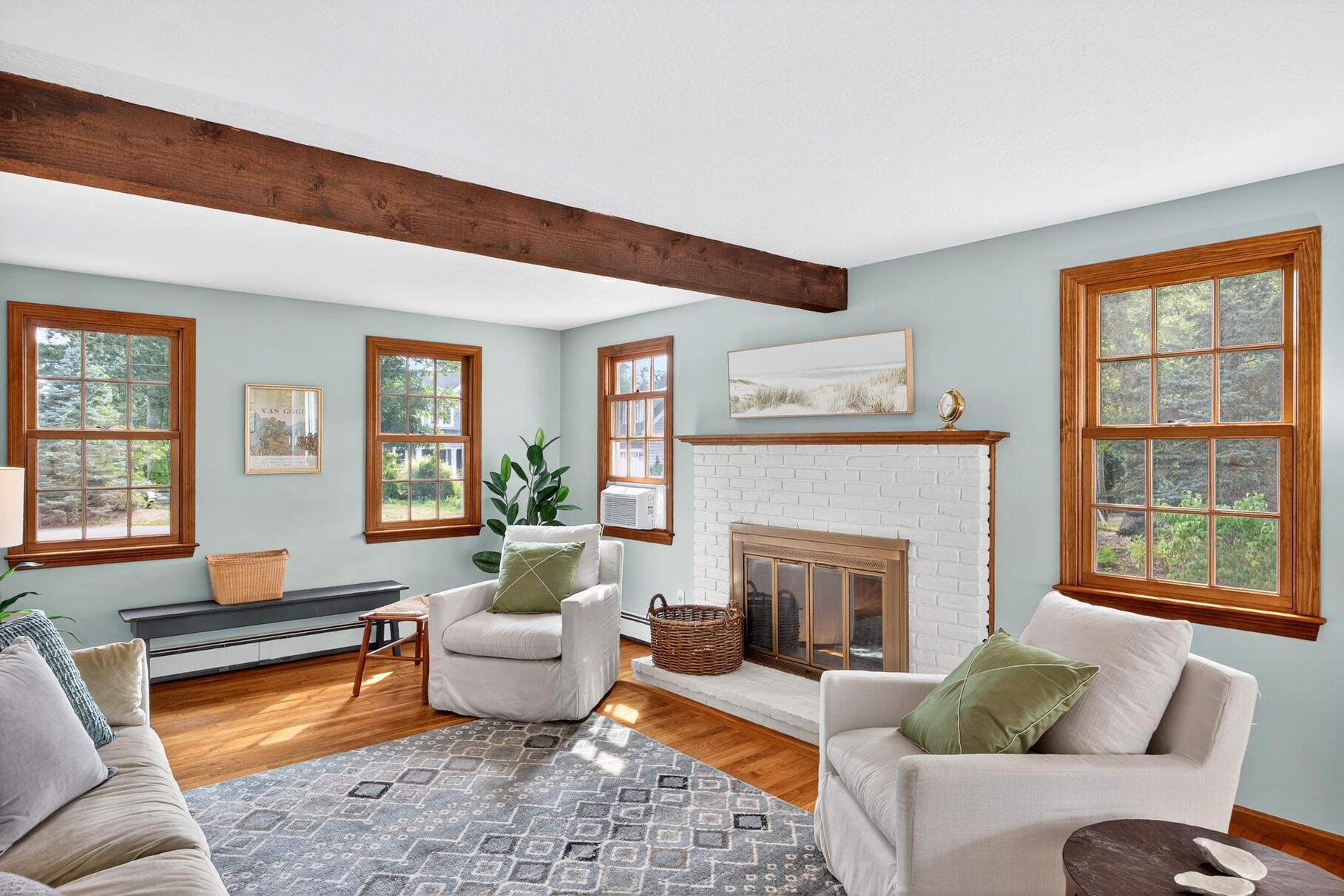 24 Tracey Road Cotuit, MA 02635 - Photo 11 of 45 a living room with furniture and a fireplace