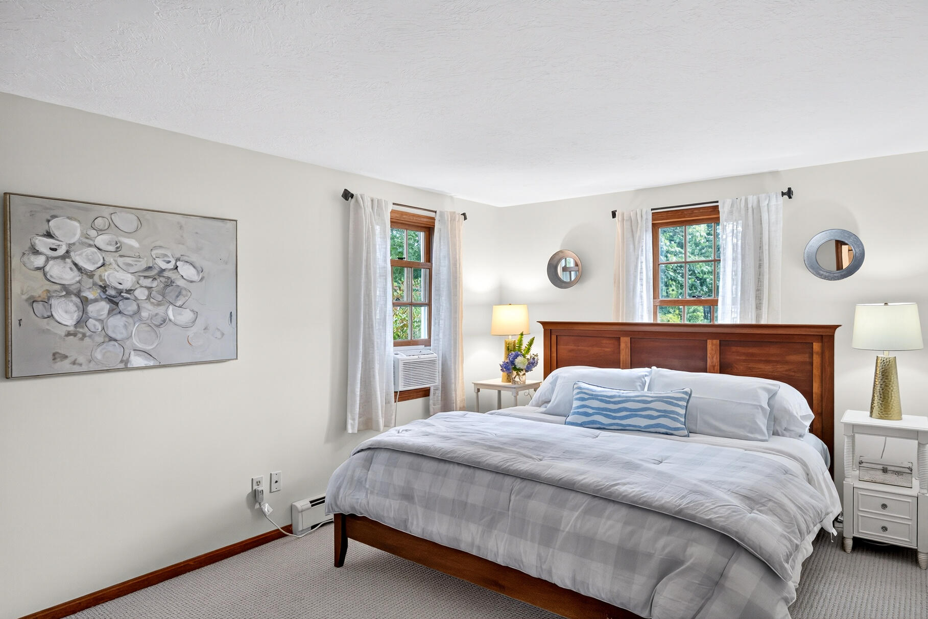 24 Tracey Road Cotuit, MA 02635 - Photo 19 of 45 a bedroom with a large bed and a window