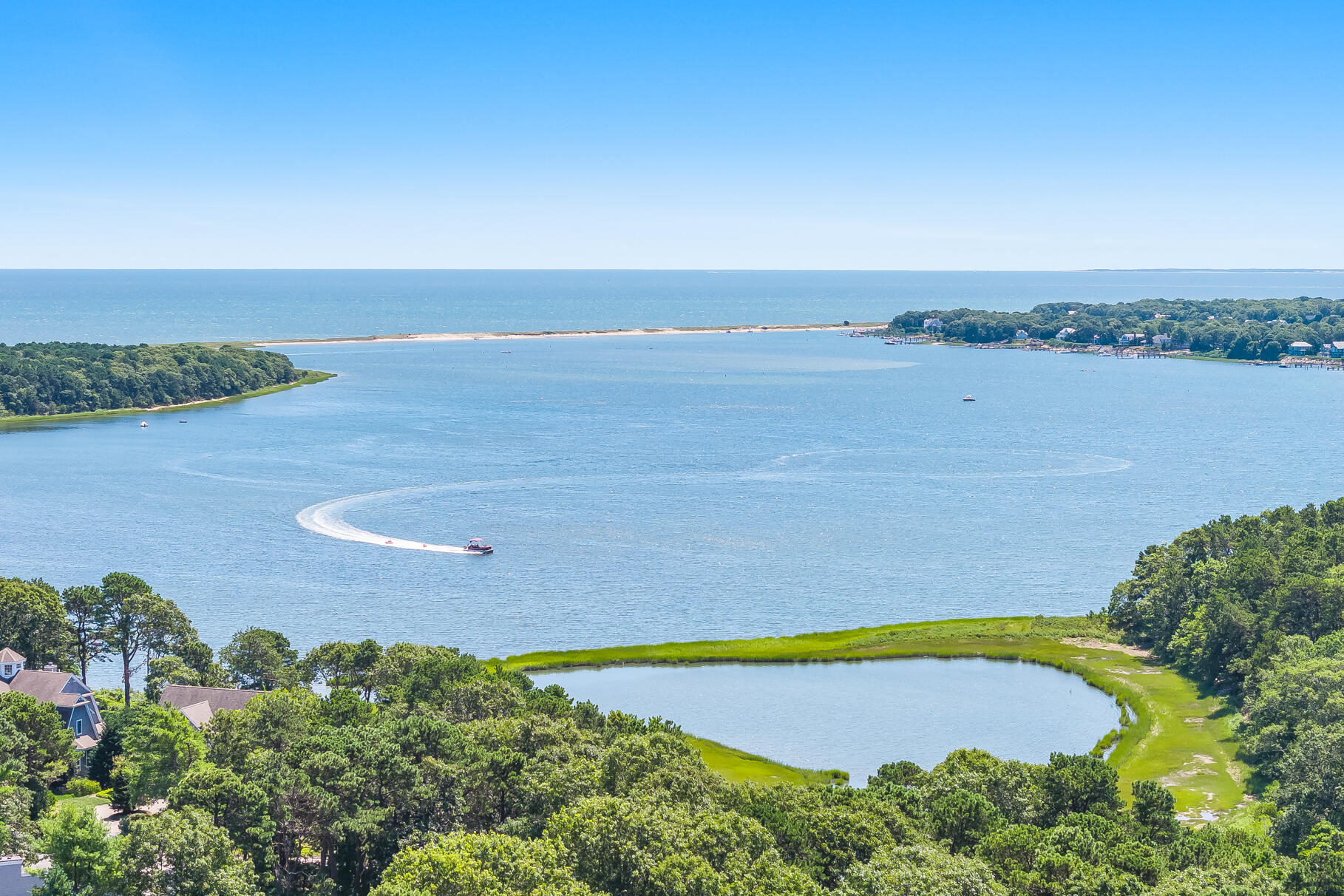 24 Tracey Road Cotuit, MA 02635 - Photo 3 of 45 an aerial view of a houses with a lake view