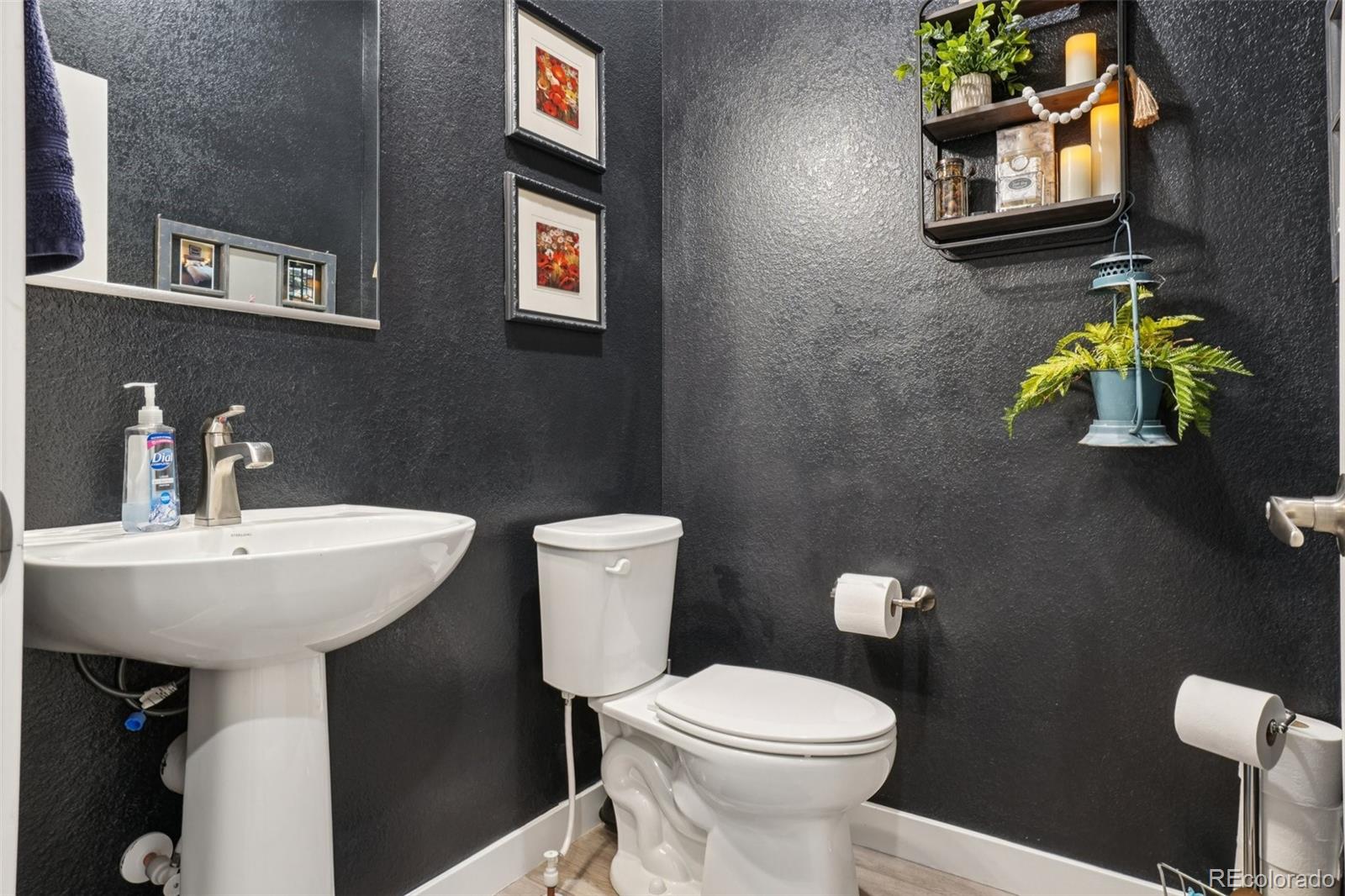 12541 Lake View Street Firestone, CO 80504 - Photo 14 of 50 a bathroom with a sink a toilet and mirror