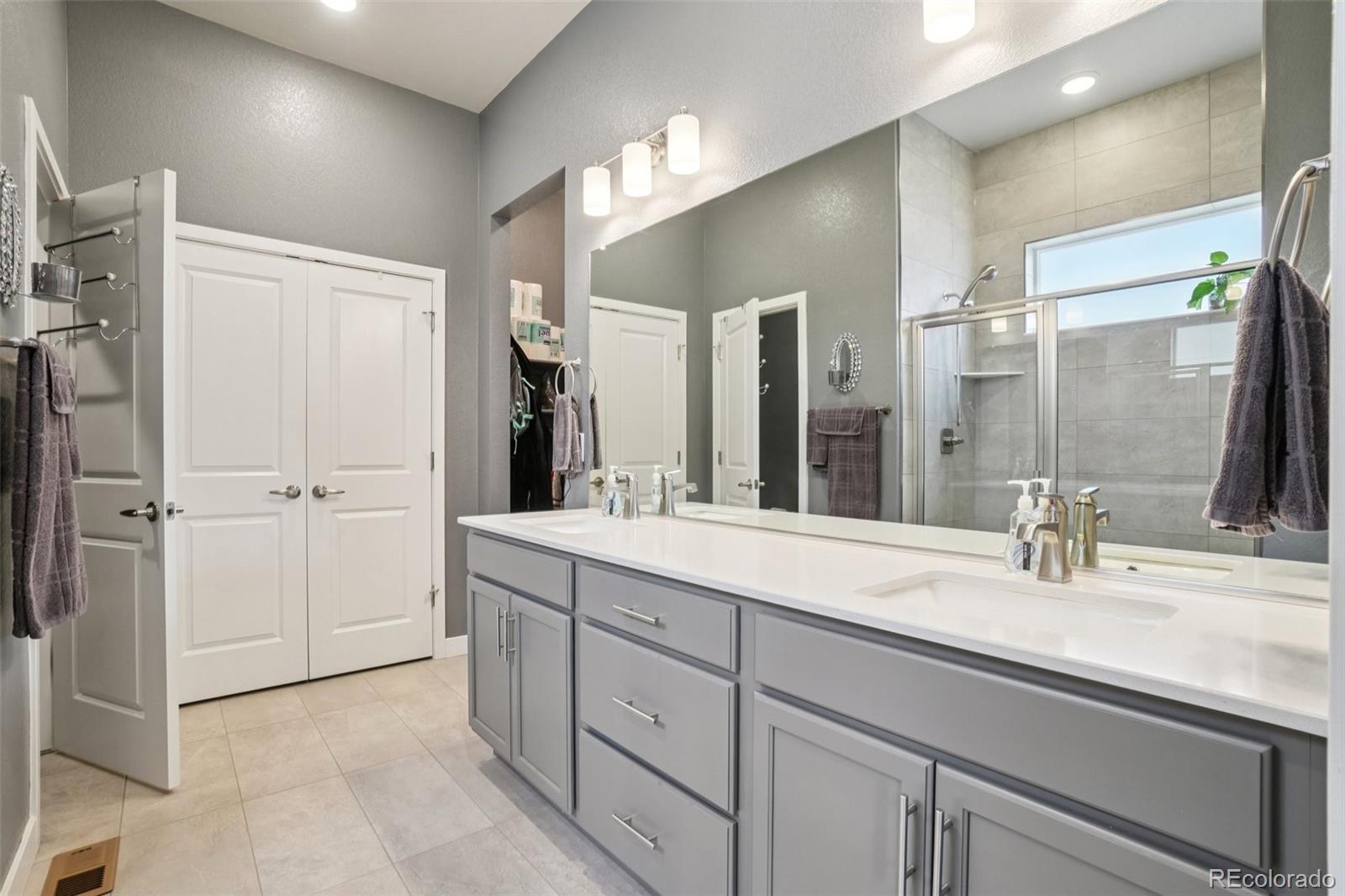 12541 Lake View Street Firestone, CO 80504 - Photo 18 of 50 a bathroom with a sink and a mirror