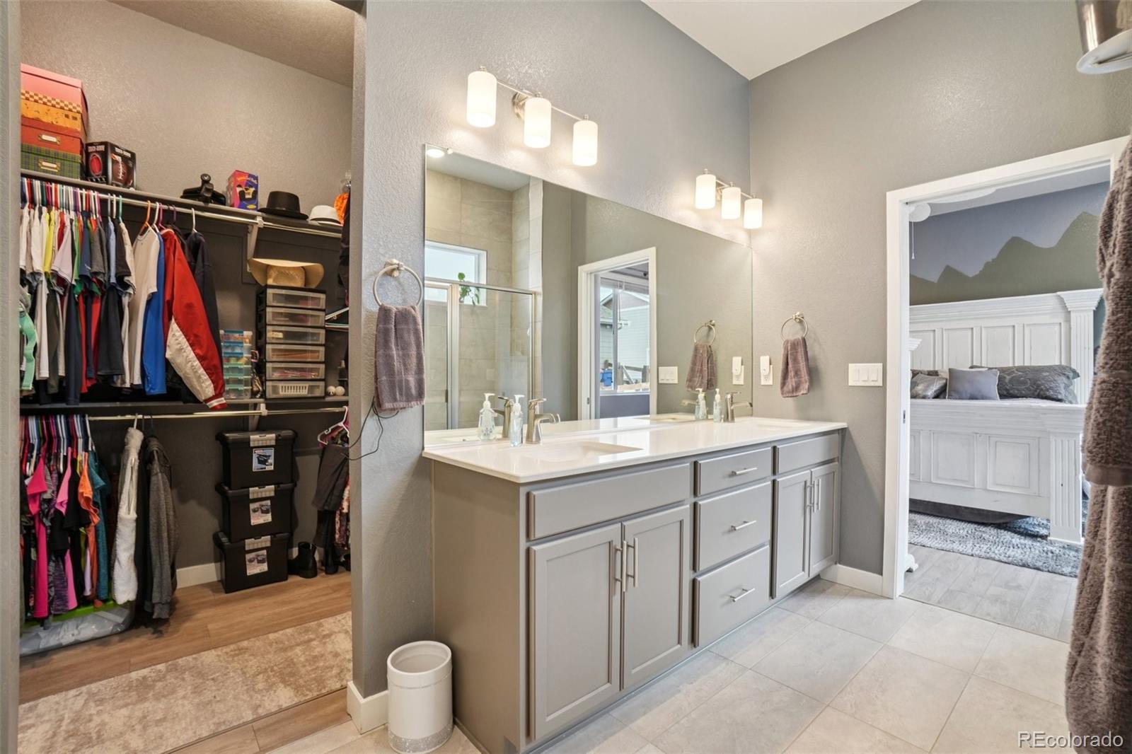12541 Lake View Street Firestone, CO 80504 - Photo 20 of 50 a bathroom with a double vanity sink and a mirror