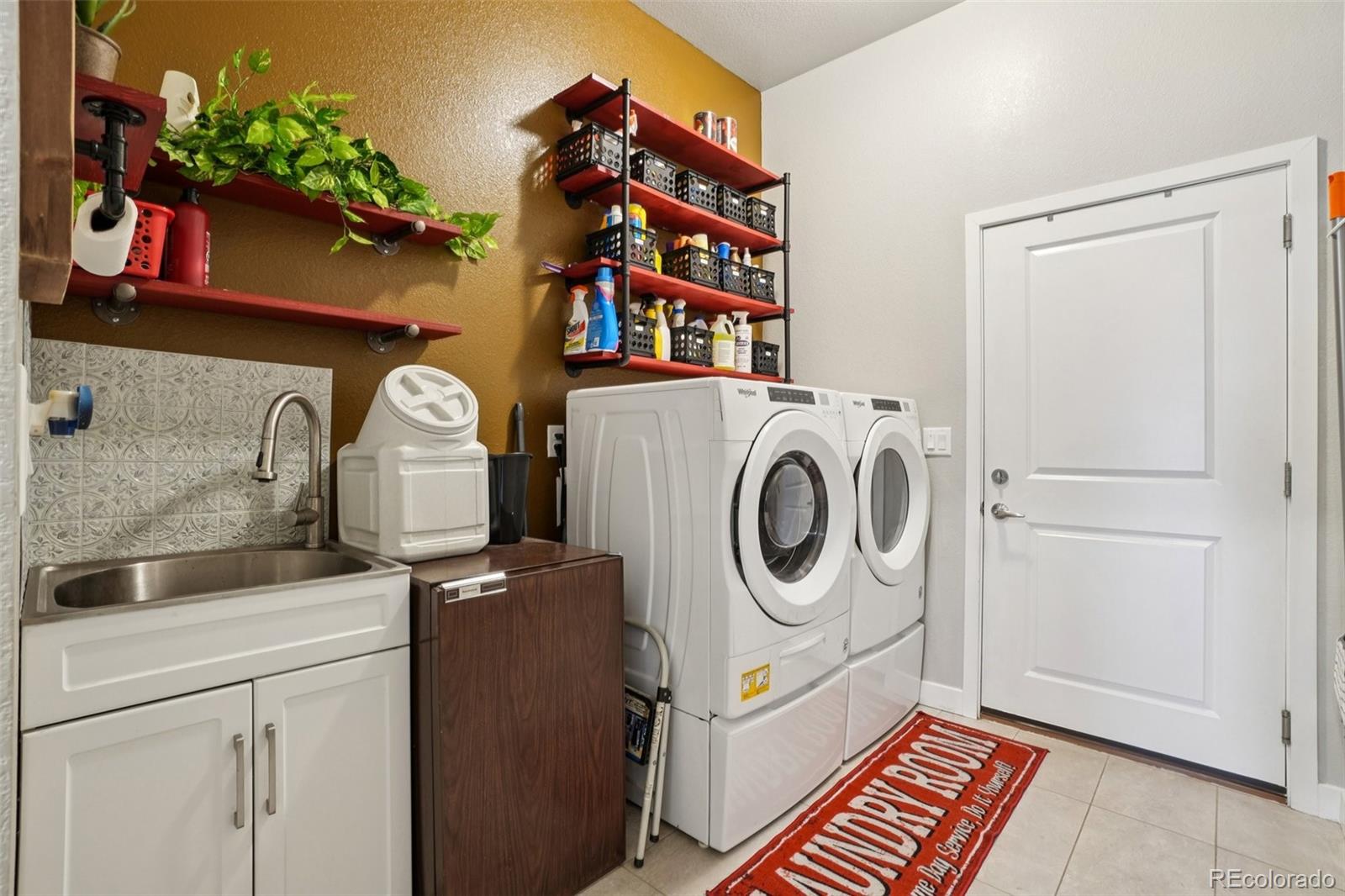 12541 Lake View Street Firestone, CO 80504 - Photo 21 of 50 a utility room with dryer and washer
