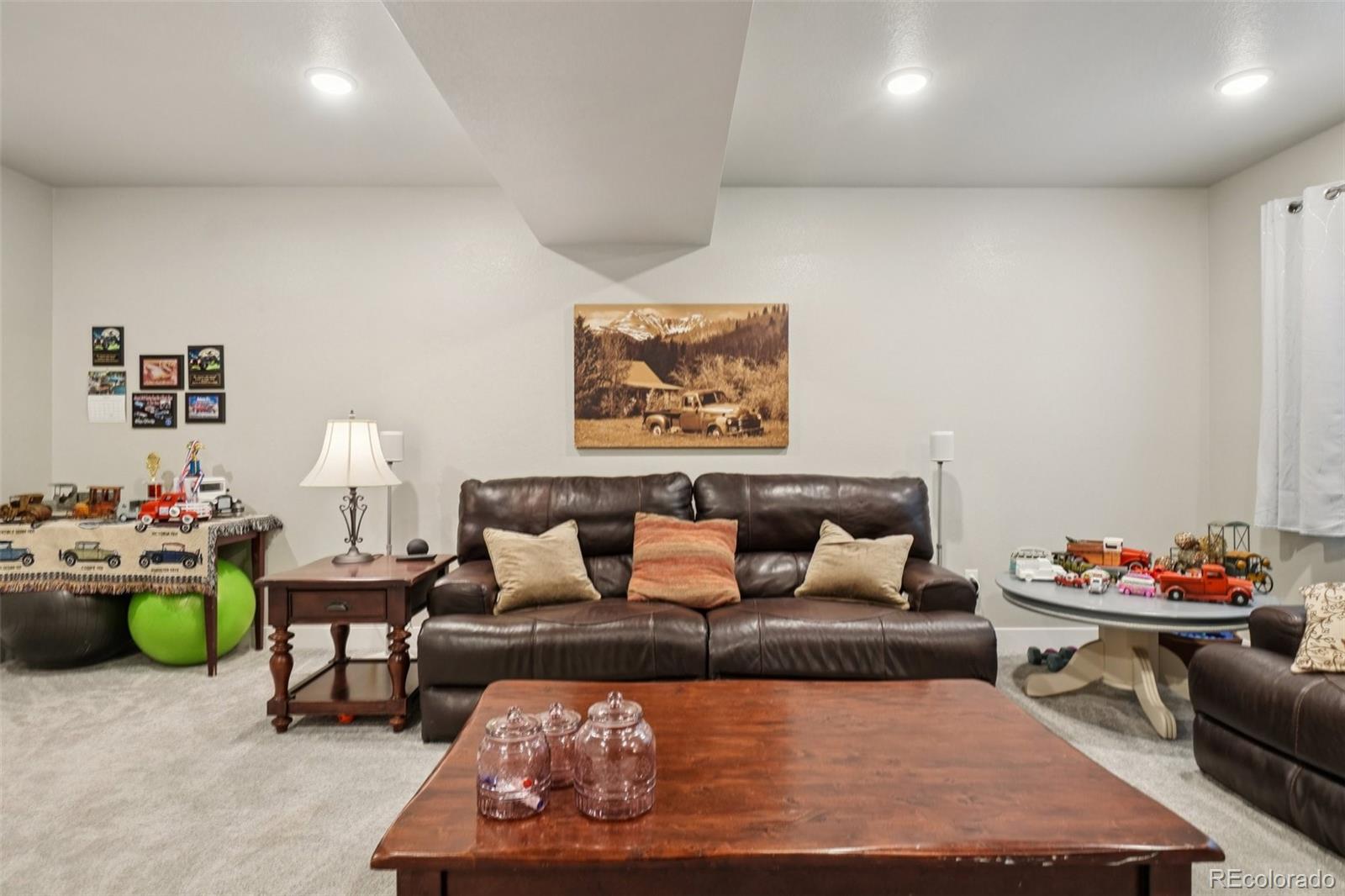 12541 Lake View Street Firestone, CO 80504 - Photo 22 of 50 a living room with furniture and a couch