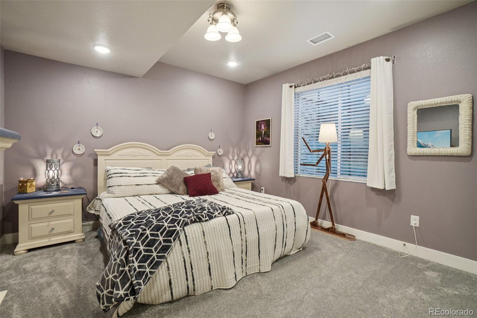 12541 Lake View Street Firestone, CO 80504 - Photo 25 of 50 a bedroom with a bed and window