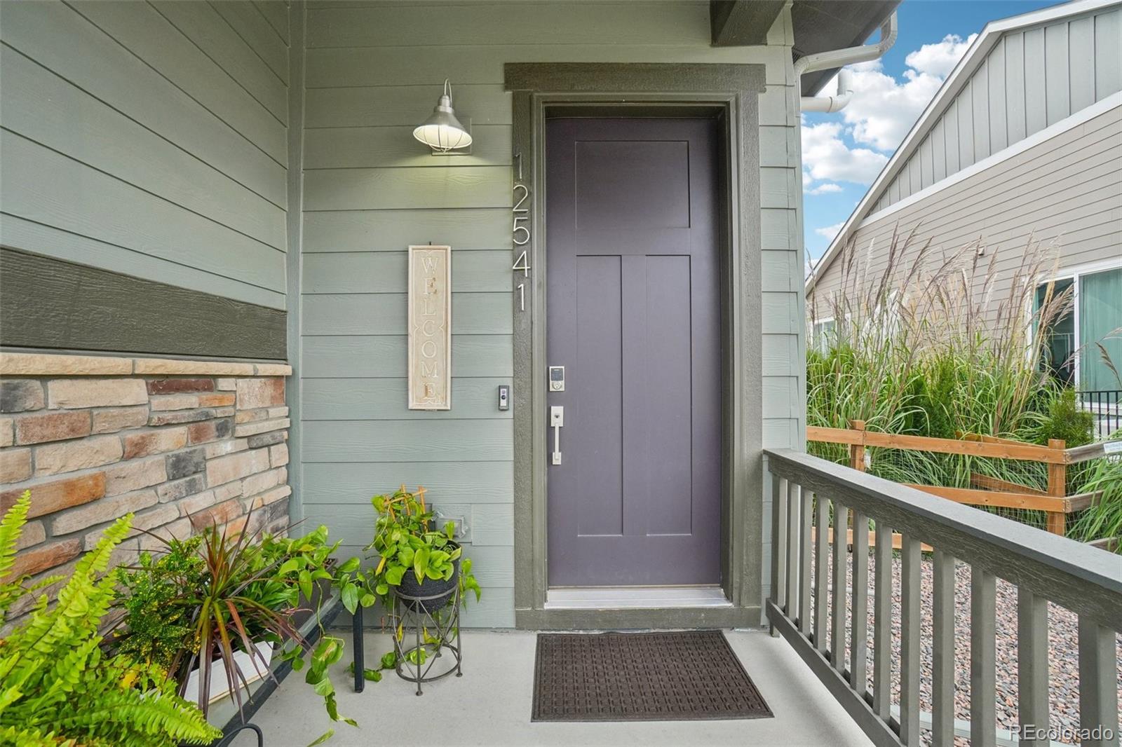 12541 Lake View Street Firestone, CO 80504 - Photo 37 of 50 a view of a balcony with a potted plant