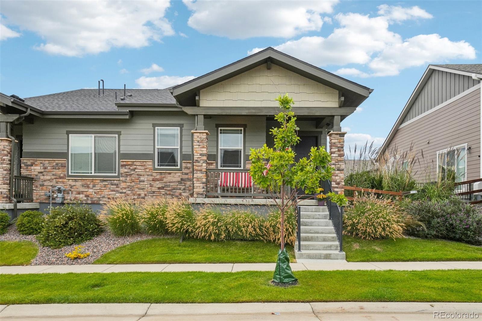 12541 Lake View Street Firestone, CO 80504 - Photo 39 of 50 a front view of a house with a yard