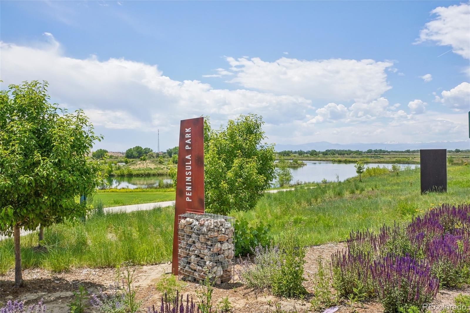 12541 Lake View Street Firestone, CO 80504 - Photo 48 of 50 a view of a lake with a big yard