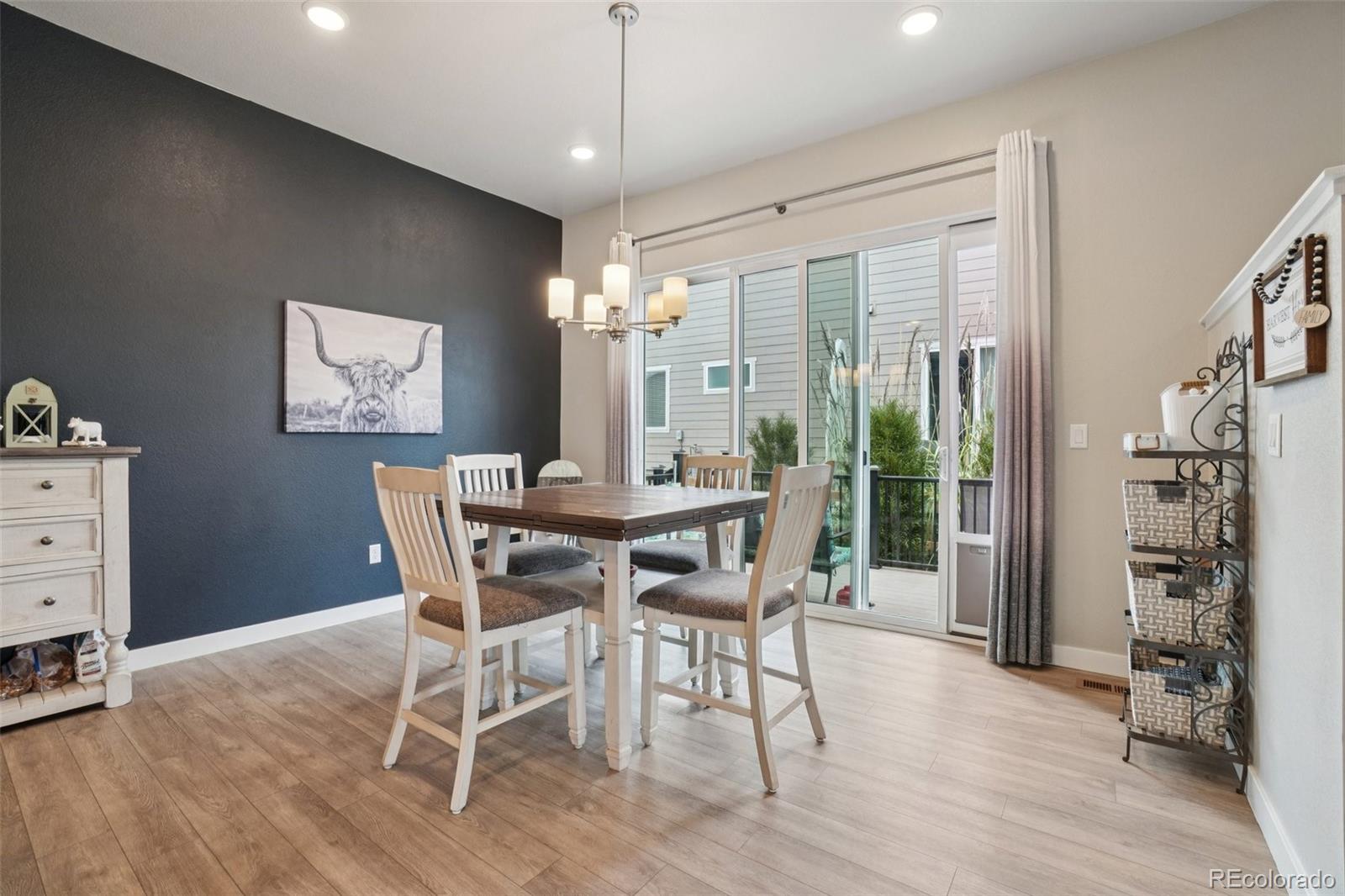 12541 Lake View Street Firestone, CO 80504 - Photo 10 of 50 a view of a dining room with furniture window and wooden floor