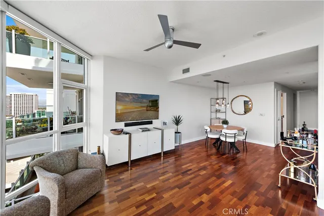 a kitchen with stainless steel appliances granite countertop a stove and a large window