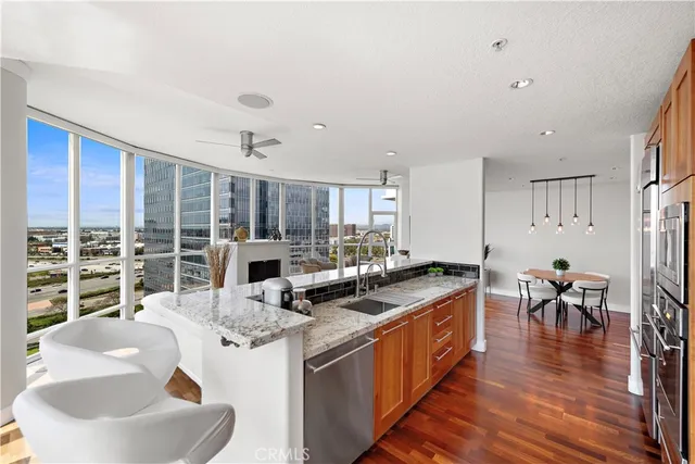 a kitchen with stainless steel appliances granite countertop a stove and a sink