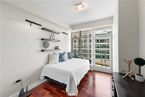 a living room with furniture a rug and white walls