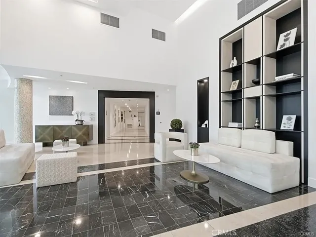 a living room with furniture and large window