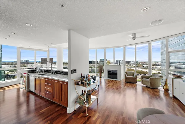 a kitchen with lots of counter top space a sink appliances and cabinets