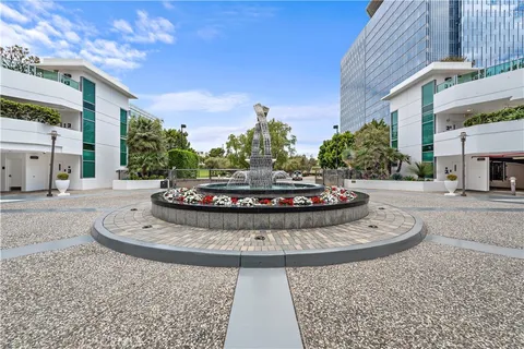 a living room with furniture a table and a window