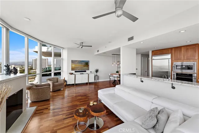 a kitchen with stainless steel appliances granite countertop a stove and a wooden cabinets